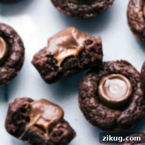 Decadent Rolo Brownie Minis 3 Mini brownie bites with Rolos; one is cut in half to expose the gooey, melty insides.