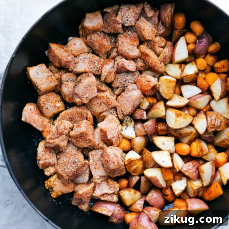 This lemon chicken and potatoes can be ready in 30 minutes or less! Chicken, potatoes and carrots in a skillet.