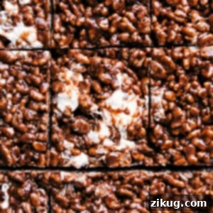 Chocolate Rice Krispie Treats cut into squares, showcasing their rich color and texture.