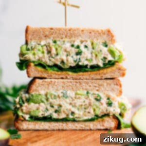 A vibrant, close-up shot of the finished Avocado Tuna Salad in a bowl, showcasing its creamy texture, visible chunks of avocado, and finely diced vegetables, perfectly ready to be served and enjoyed.
