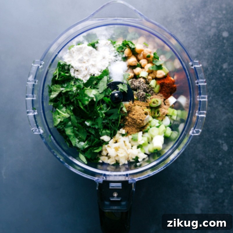 Preparing Falafel Recipe: Combining Ingredients in Food Processor Making falafel by adding all ingredients into a food processor as part of the falafel recipe preparation.