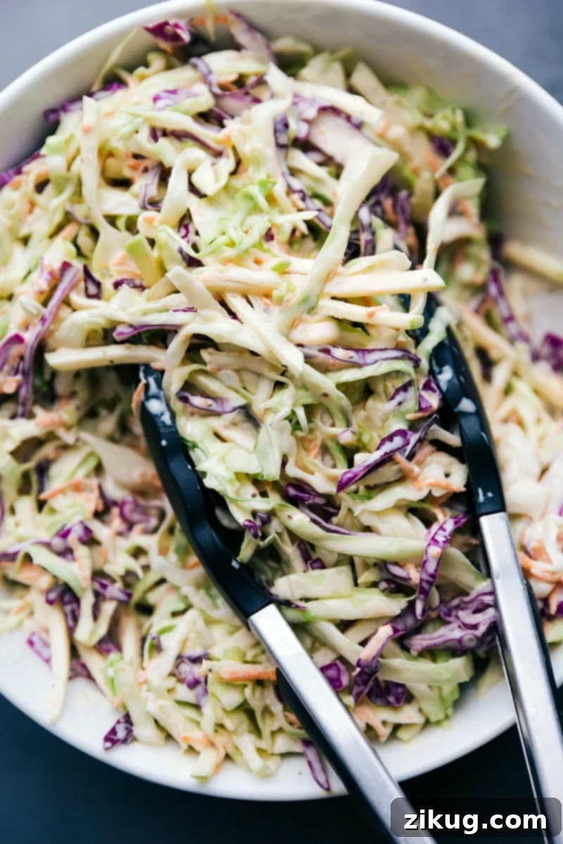 Ready-to-Serve Dressed Coleslaw in a Large Bowl Freshly prepared creamy coleslaw in a large serving bowl, perfectly dressed and ready to be enjoyed.
