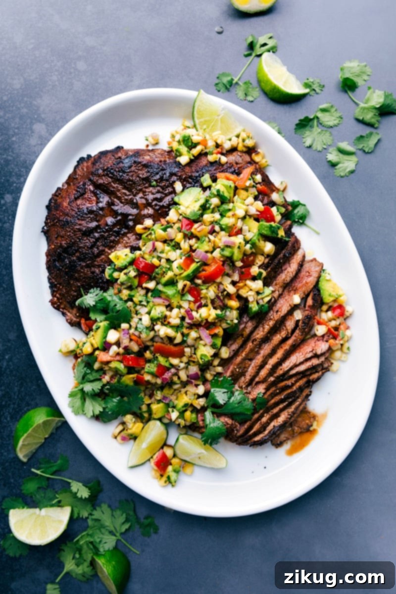 Perfectly Cooked Stuffed Flank Steak with Corn Salsa, Ready to Enjoy Sliced flank steak with corn salsa showing the perfectly cooked interior, creating a deliciously complimentary meal.