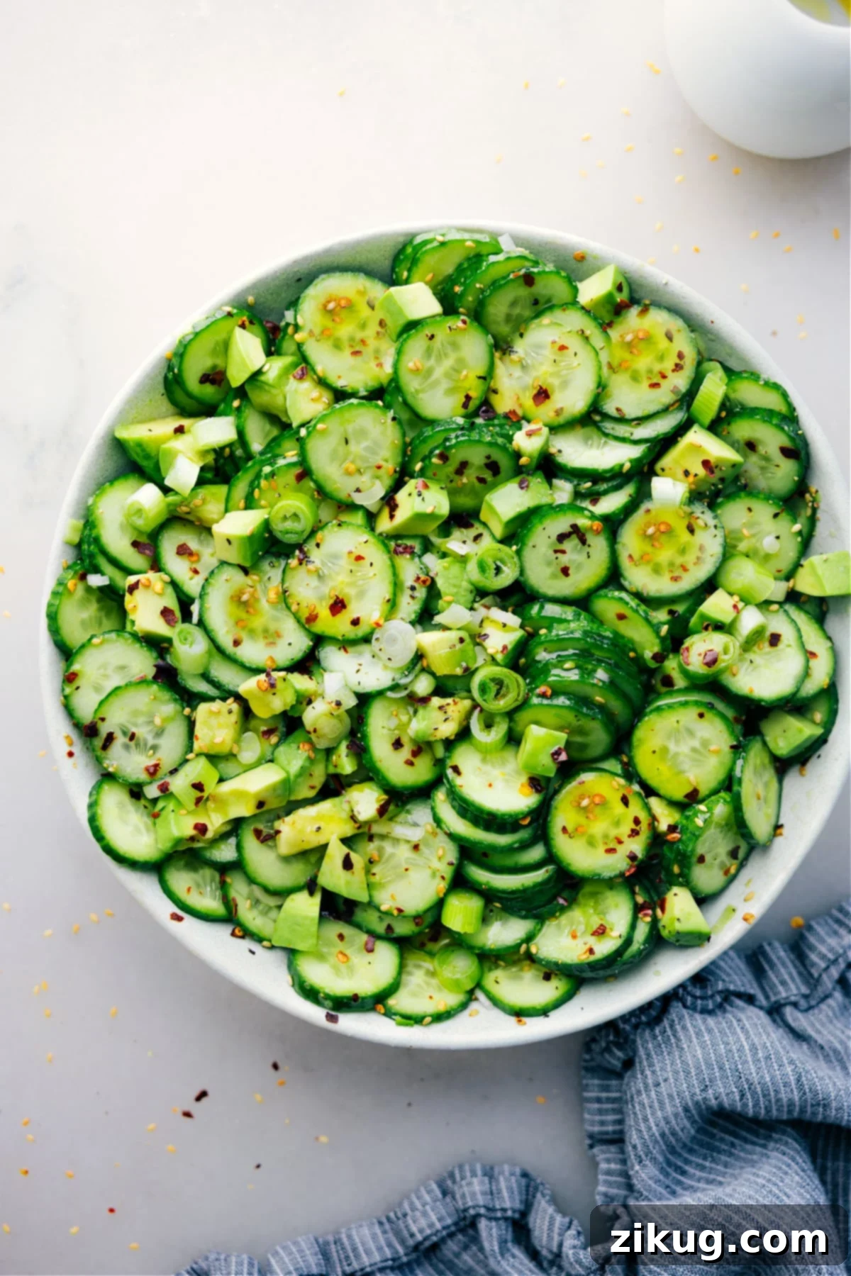 Asian Cucumber Salad in a bowl ready to be enjoyed.