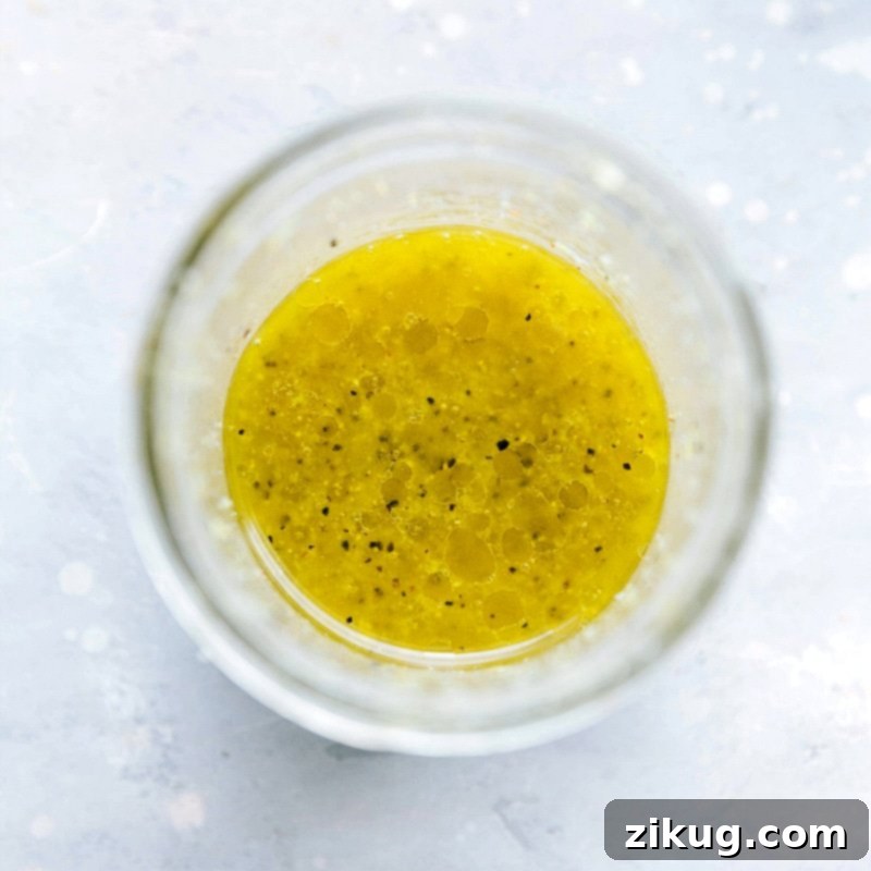 Homemade Lemon Dressing - Perfect Accompaniment for Orzo Pasta Salad Delicious homemade lemon dressing prepared for the recipe.