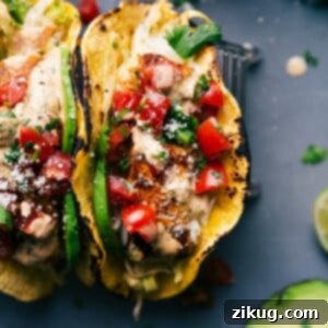 Two fish tacos stuffed with delicious toppings, ready to be savored.