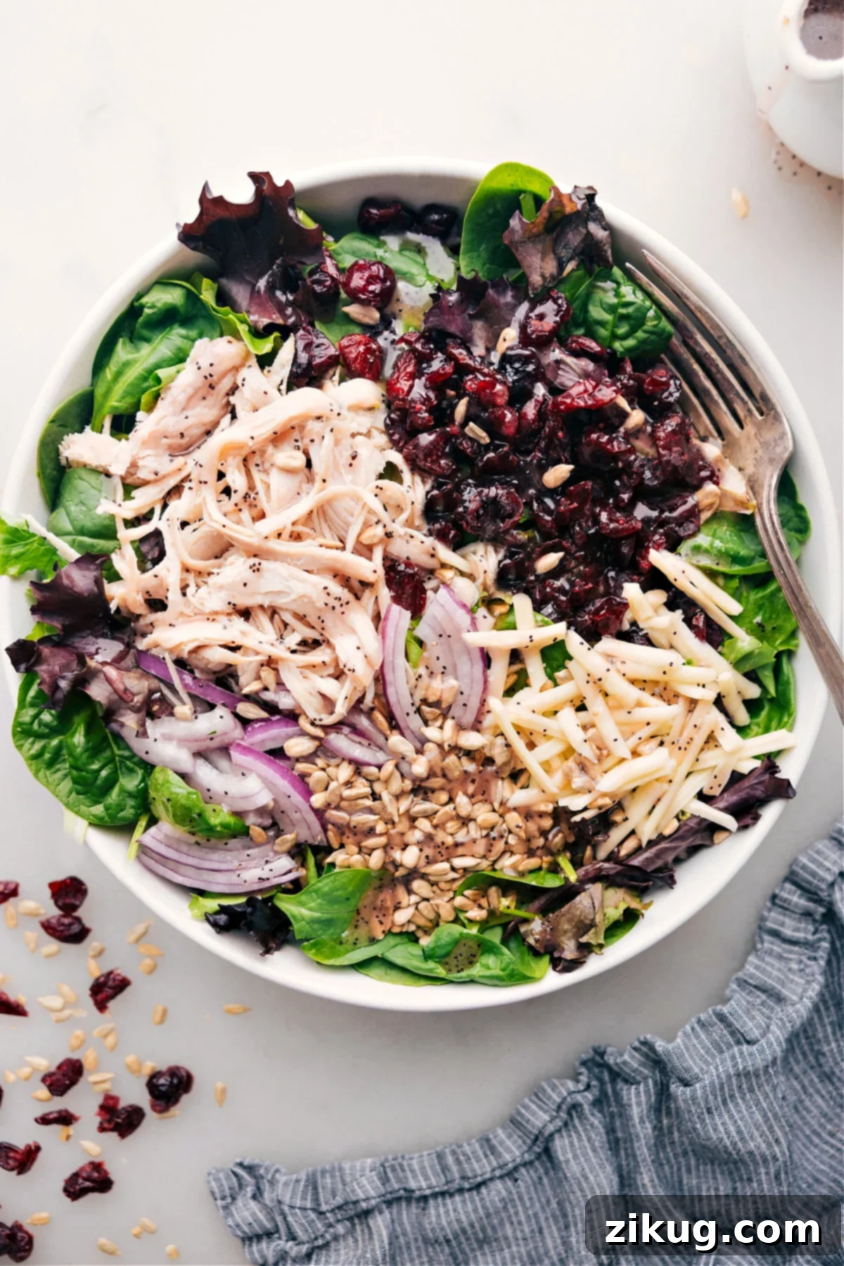 A vibrant Turkey Cranberry Salad with all its delicious ingredients displayed.