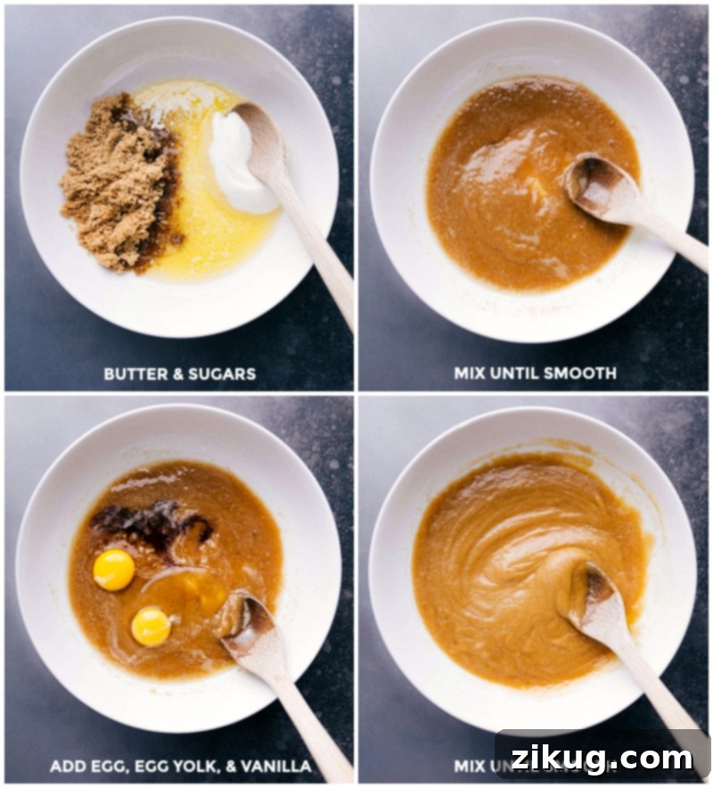 Combining butter and sugars in a mixing bowl, mixing until smooth, then adding egg, yolk, and vanilla, and mixing again until the mixture is smooth and creamy.