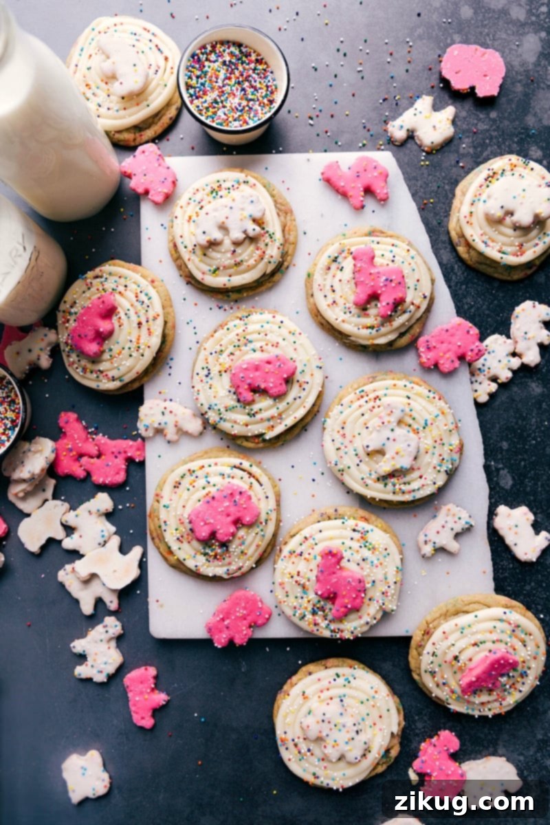Deliciously decorated Animal Circus Cookies with vibrant sprinkles and a frosted animal cracker on top, showcasing their playful and enticing appearance.