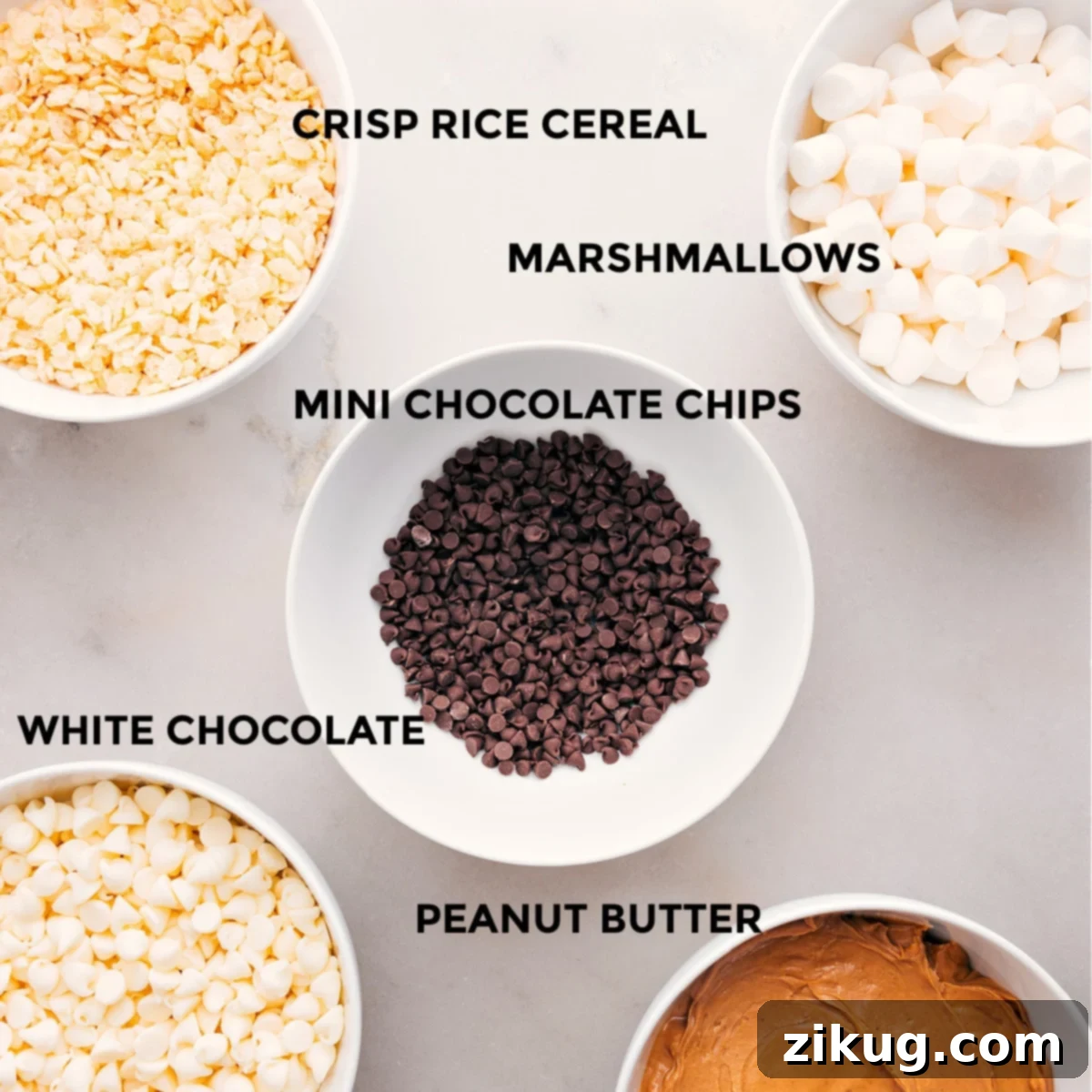 Key Ingredients for Delicious Avalanche Cookies All essential ingredients for Avalanche Cookies are displayed: miniature marshmallows, chocolate chips, premium white chocolate, creamy peanut butter, and crispy rice cereal.