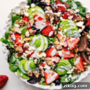 A vibrant Strawberry Poppyseed Salad with creamy dressing.