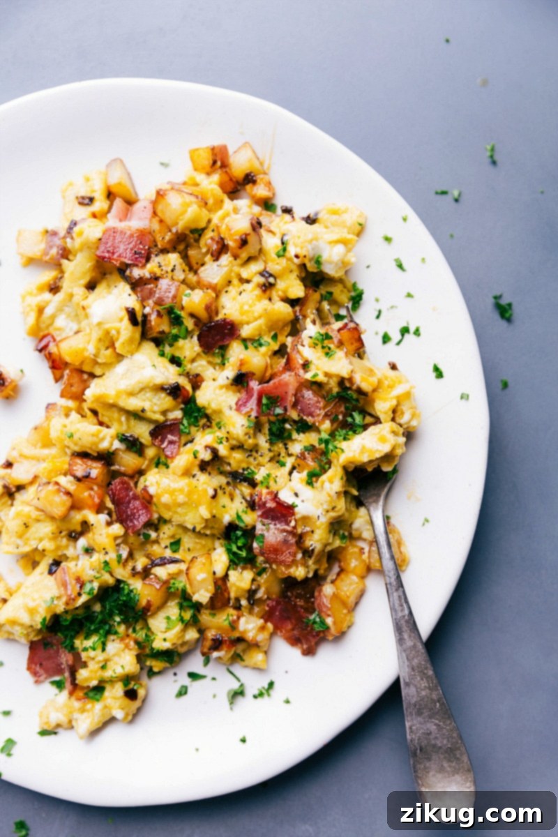 Savory Egg Skillet Garnished with Parsley, Served on a Plate and Ready for Consumption. Egg skillet on a plate garnished with fresh parsley, ready to eat.
