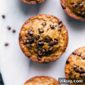 Gluten-free banana muffins with chocolate chips, freshly baked and steaming, ready to be enjoyed.