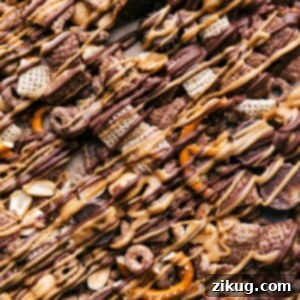 Chocolate Peanut Butter Party Mix 2 The finished chocolate peanut butter snack mix, showcasing its irresistible appeal and ready to be served.