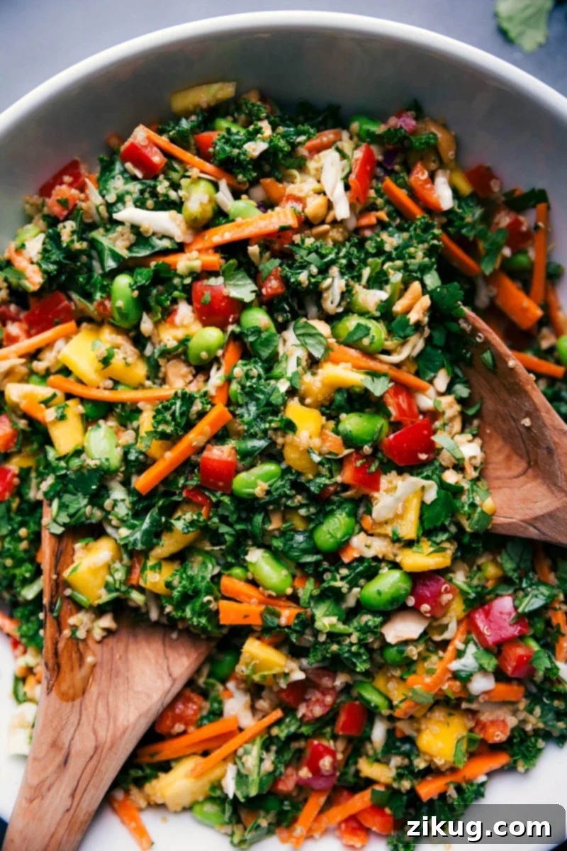 A beautifully presented Thai quinoa salad, rich with colorful ingredients and a tantalizing peanut dressing, ready to be enjoyed.