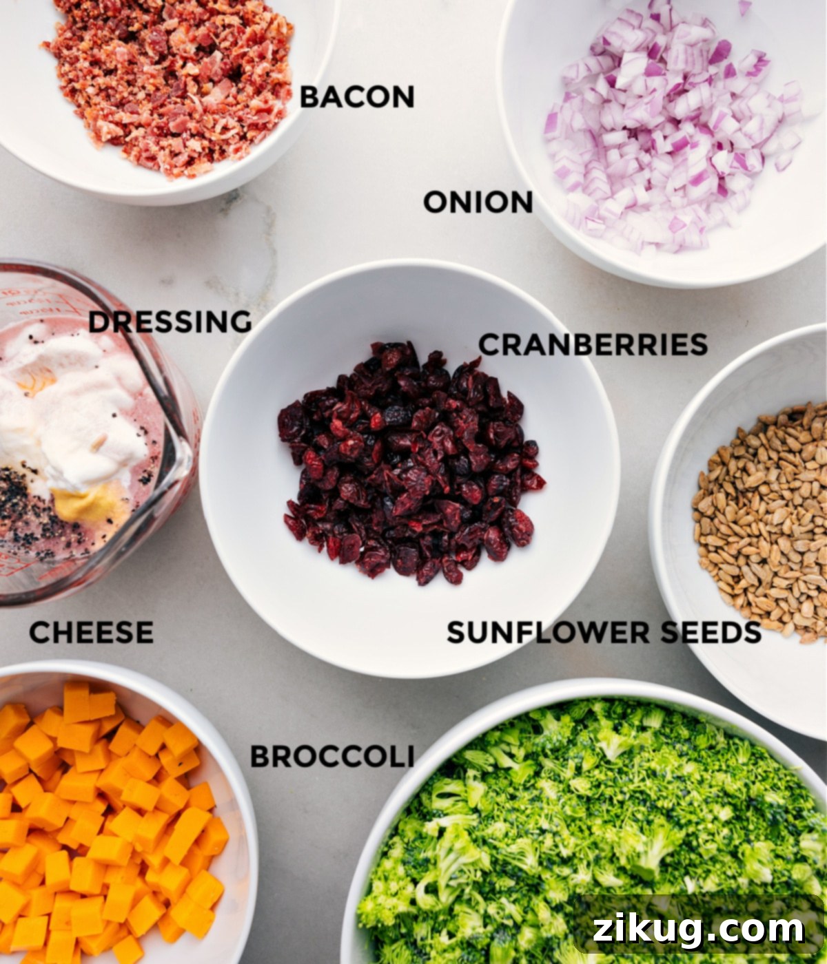 Essential Ingredients for an Easy Broccoli Salad All fresh ingredients for an easy broccoli salad prepped and laid out on a clean surface, ready for quick assembly.