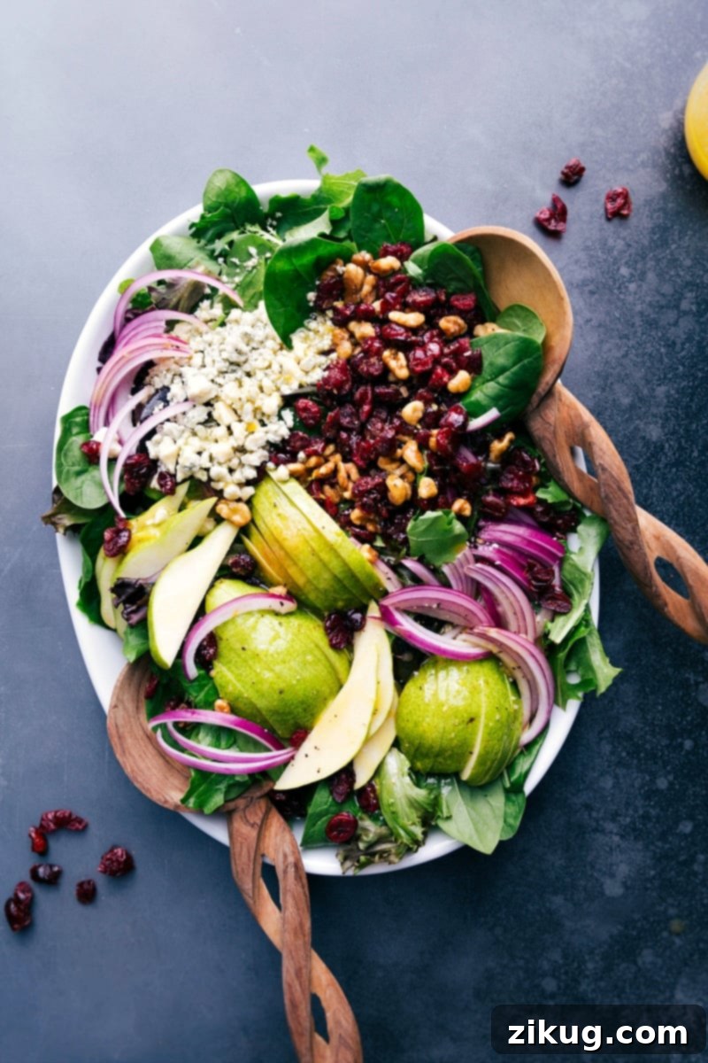 This show-stopping Pear Salad with fresh ingredients. A beautifully arranged pear salad on a decorative serving tray, highlighting fresh ingredients and vibrant colors.