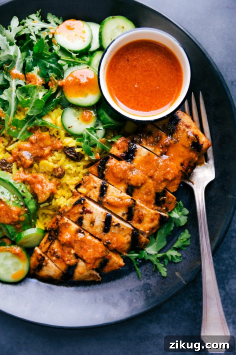 Chicken and Yellow Rice on a plate ready to be eaten.