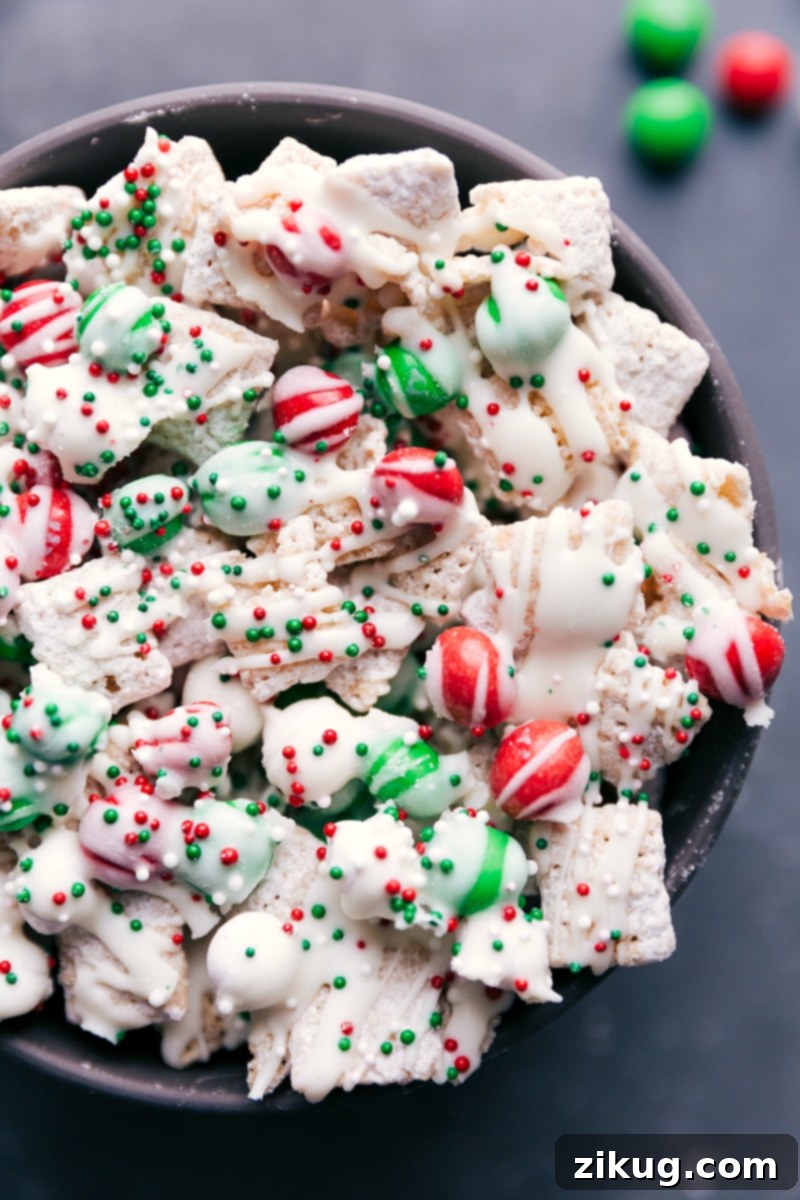 A festive bowl filled with delicious Sugar Cookie Snack Mix, garnished with colorful sprinkles, ready to be enjoyed.