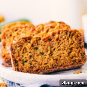 Close-up of a slice of Healthy Zucchini Bread with a perfect crumb.