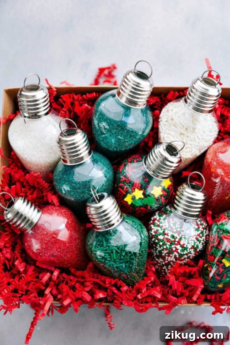 Overhead view of a box filled with ornaments overflowing with vibrant cookie sprinkles, a key component of a DIY cookie kit.