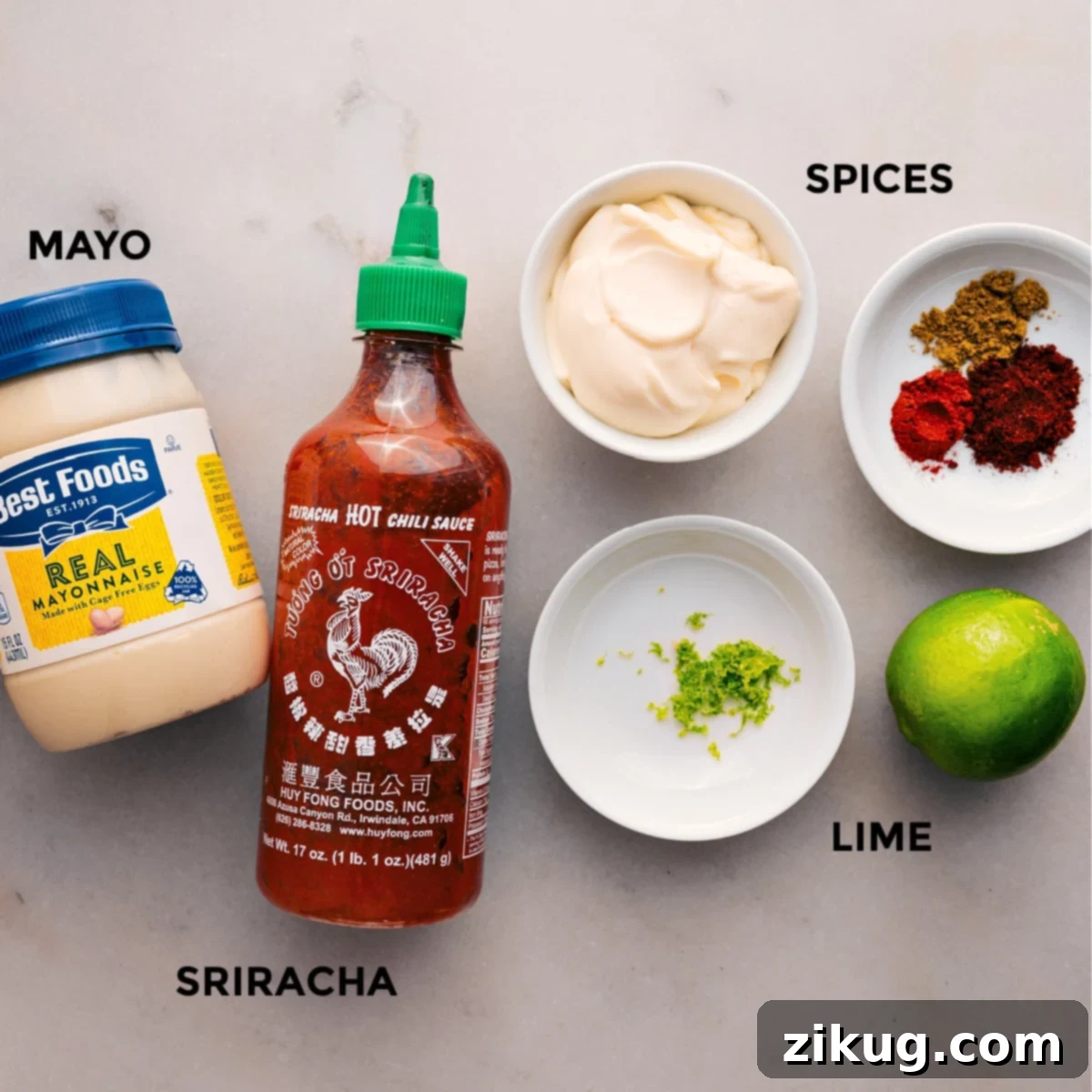 The sauce ingredients are prepped and ready to go, including mayo, sriracha, spices, and limes.