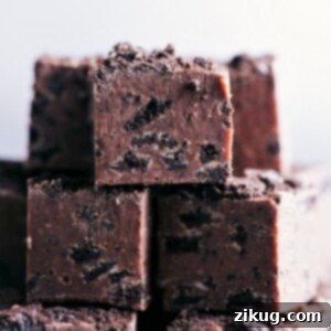 Decadent Oreo Chocolate Fudge 8 A perfectly cut piece of Chocolate Covered Oreo Fudge, showing its rich texture and crunchy Oreo pieces.