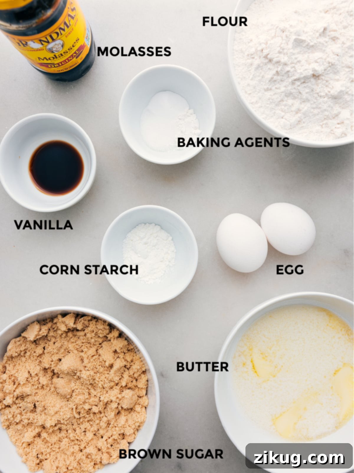 Key Ingredients For Perfect Brown Sugar Cookies All essential ingredients for brown sugar cookies, including butter, eggs, brown sugar, molasses, vanilla, flour, cornstarch, baking powder, baking soda, and salt, neatly arranged for the recipe.