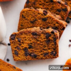 Moist and flavorful healthy pumpkin bread slices, packed with nutritious ingredients and fall spices.