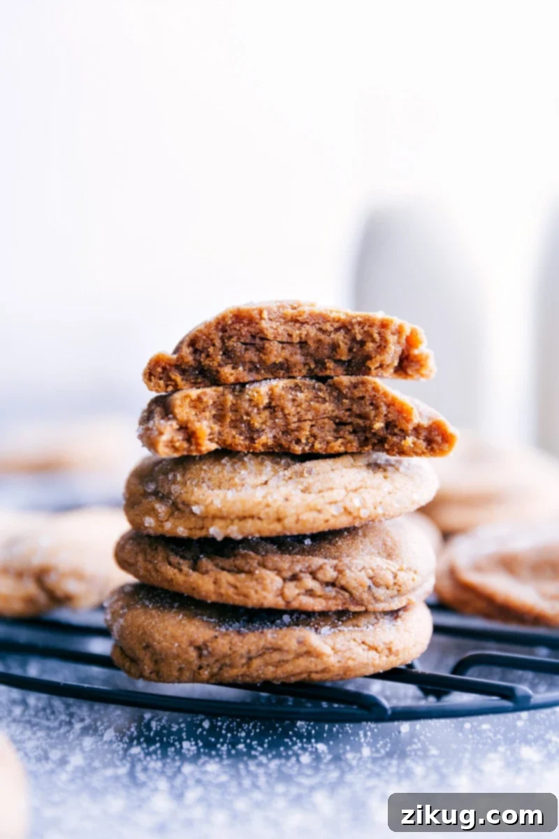 A beautifully arranged plate of freshly baked Gingersnap Cookies, stacked high and ready to be enjoyed.