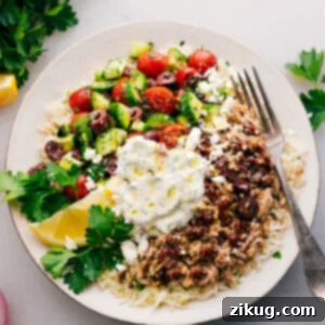 A vibrant Greek Ground Turkey Bowl with seasoned turkey, lemon-parsley rice, fresh vegetables, and tzatziki sauce.