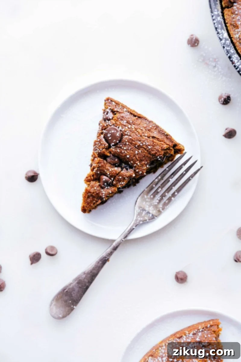 Perfectly Spiced Gluten-Free Pumpkin Cake 2 A perfectly sliced piece of gluten-free pumpkin cake, elegantly presented on a plate, highlighting its moist texture and inviting aroma.