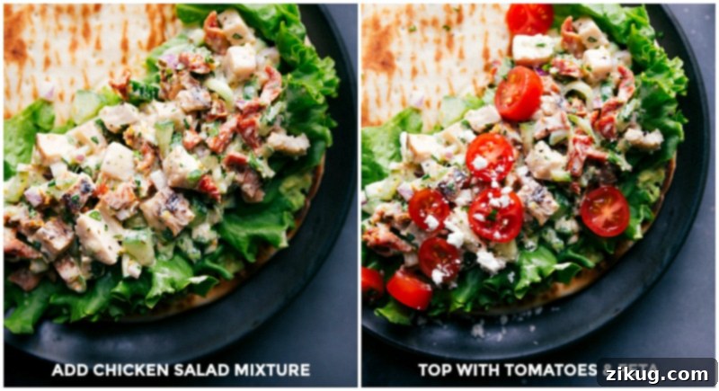 A vibrant Greek Chicken Salad spread on pita bread, with another wrap topped with crumbled feta cheese and sliced tomatoes, ready to be folded.