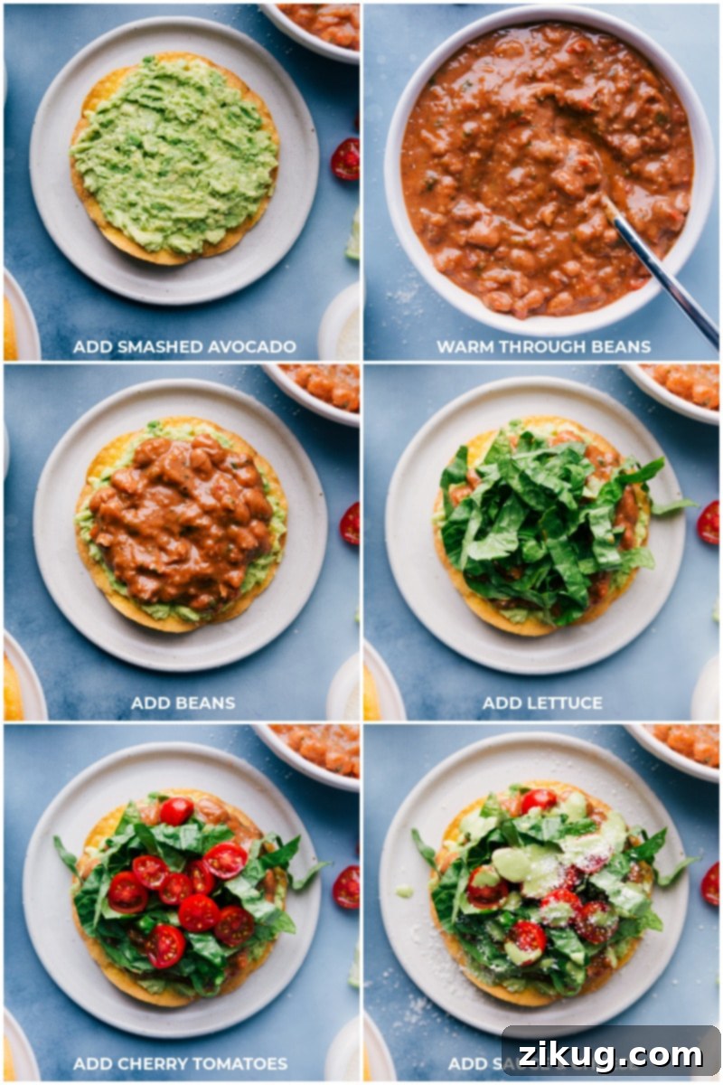 Assembling the Perfect Bean Tostada: Layers of Flavor with Avocado, Spiced Beans, Fresh Greens, Tomatoes, and Creamy Cilantro-Lime Sauce. Detailed process shots illustrating the assembly of Bean Tostadas: first, smashed avocado on the crispy tortilla, followed by saucy pinto beans, fresh shredded lettuce, halved cherry tomatoes, and a final drizzle of cilantro-cashew sauce and sprinkle of cotija cheese.
