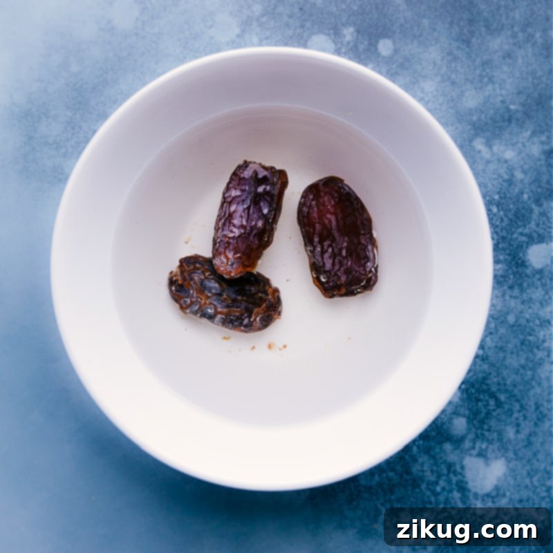 Preparation step: Soaking Medjool dates to ensure a perfectly smooth and sweet cauliflower smoothie. Process shots-- images of the dates being soaked before adding to recipe.
