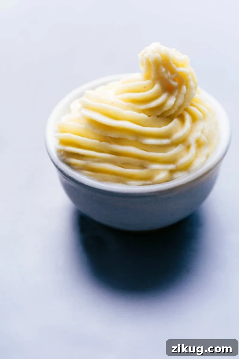 Bowl of refreshing copycat dole whip, creamy and ready for a sweet treat.