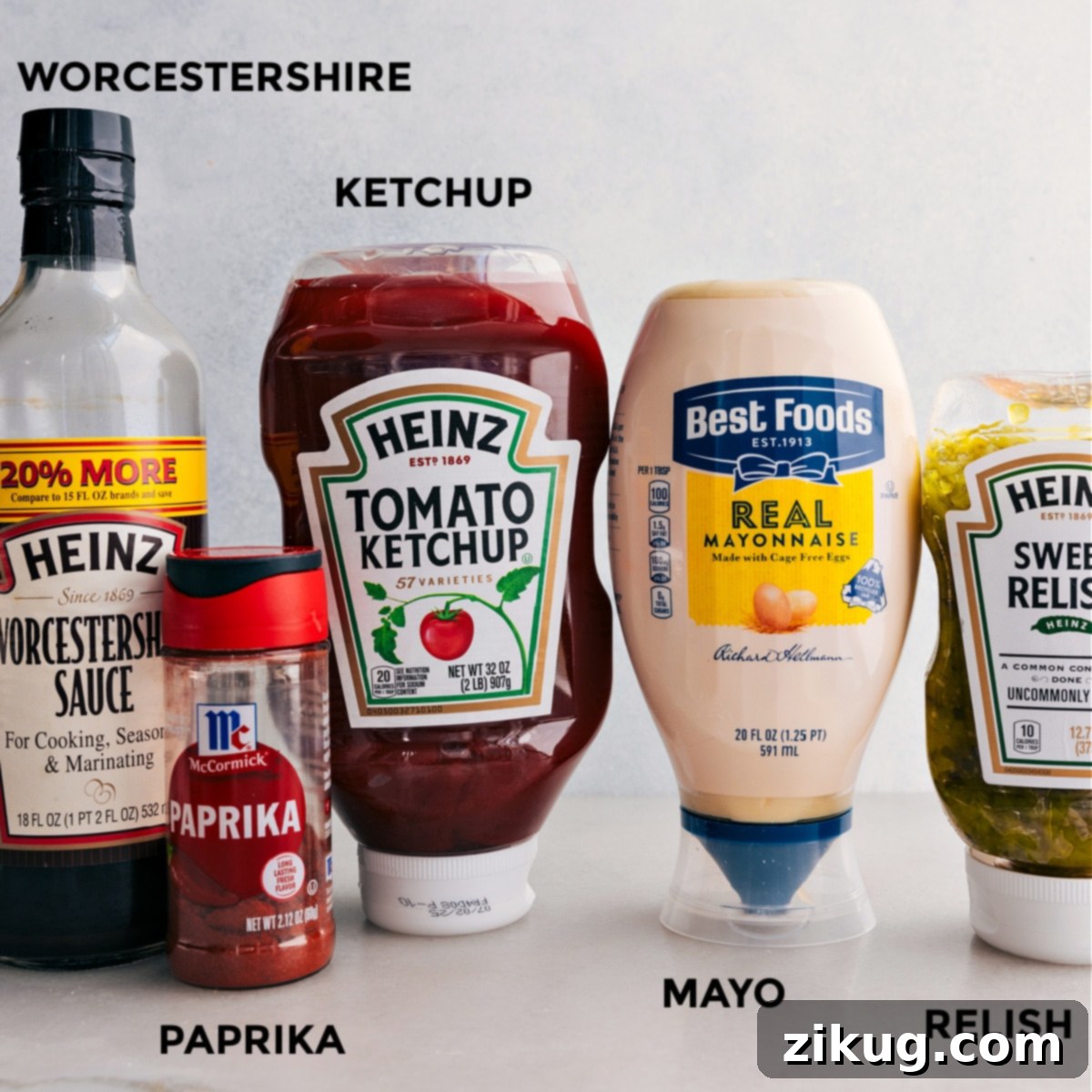 All the essential ingredients for homemade fry sauce, including creamy mayonnaise, rich ketchup, tangy relish, earthy paprika, and savory Worcestershire sauce, meticulously measured and prepared for easy assembly.
