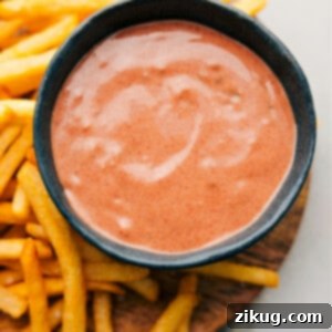A close-up shot of a small bowl filled with perfectly creamy and appealing homemade Fry Sauce.