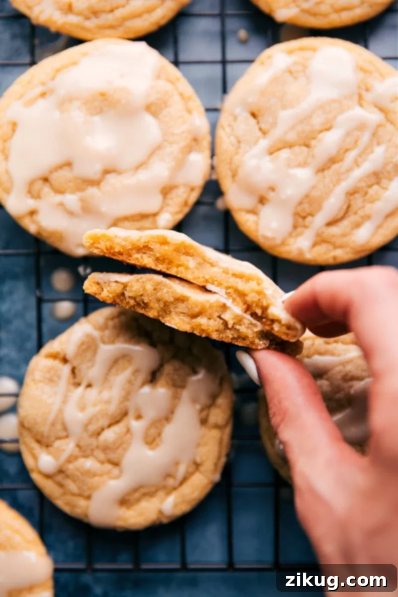 Freshly baked maple cookies with a sweet maple glaze, cooling on a wire rack, ready to be devoured.