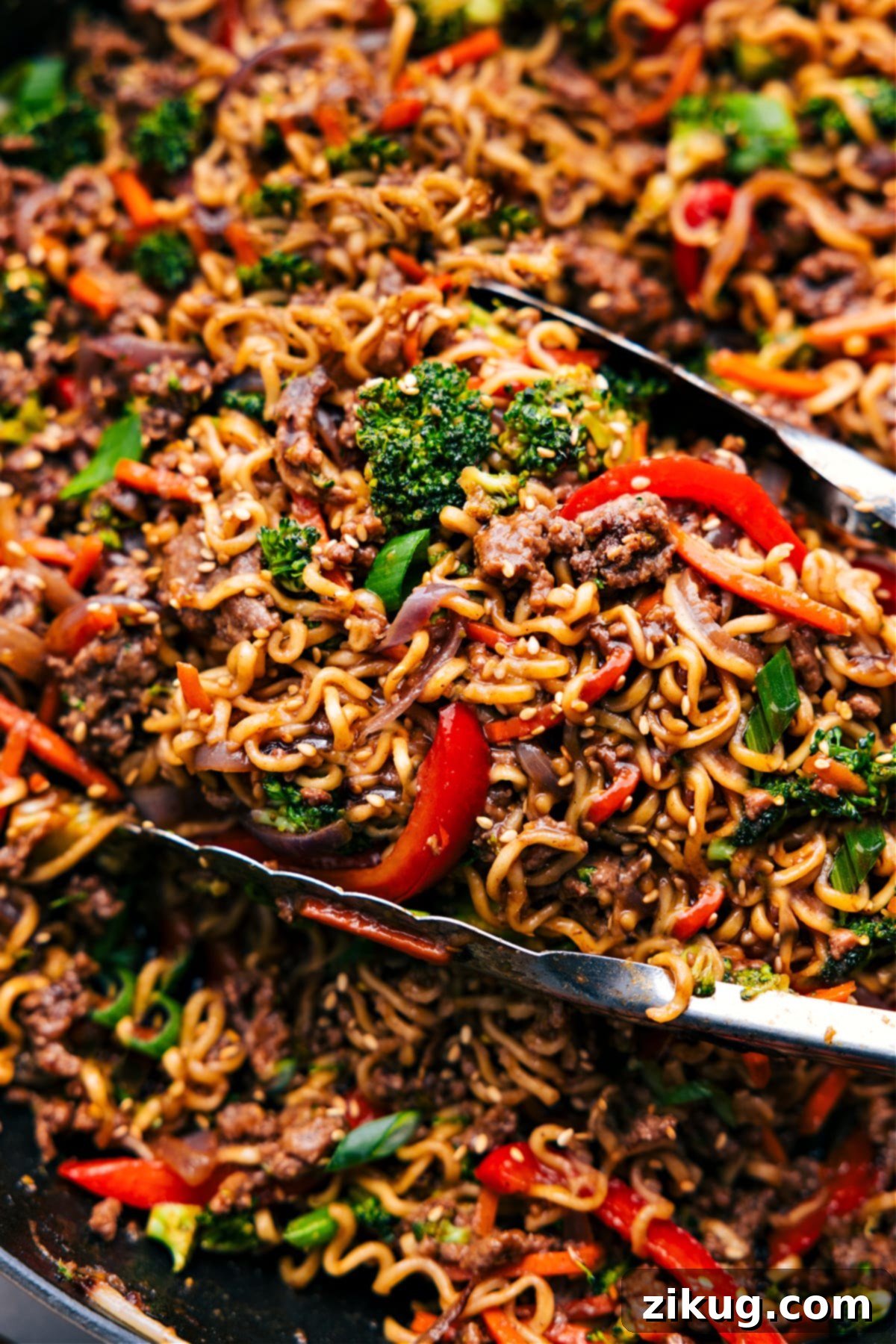 Ground Beef Ramen in the skillet, ready to be served and enjoyed, topped with sesame seeds.