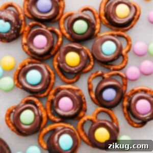 A finished Easter Pretzel with a pastel M&M, ready to eat.