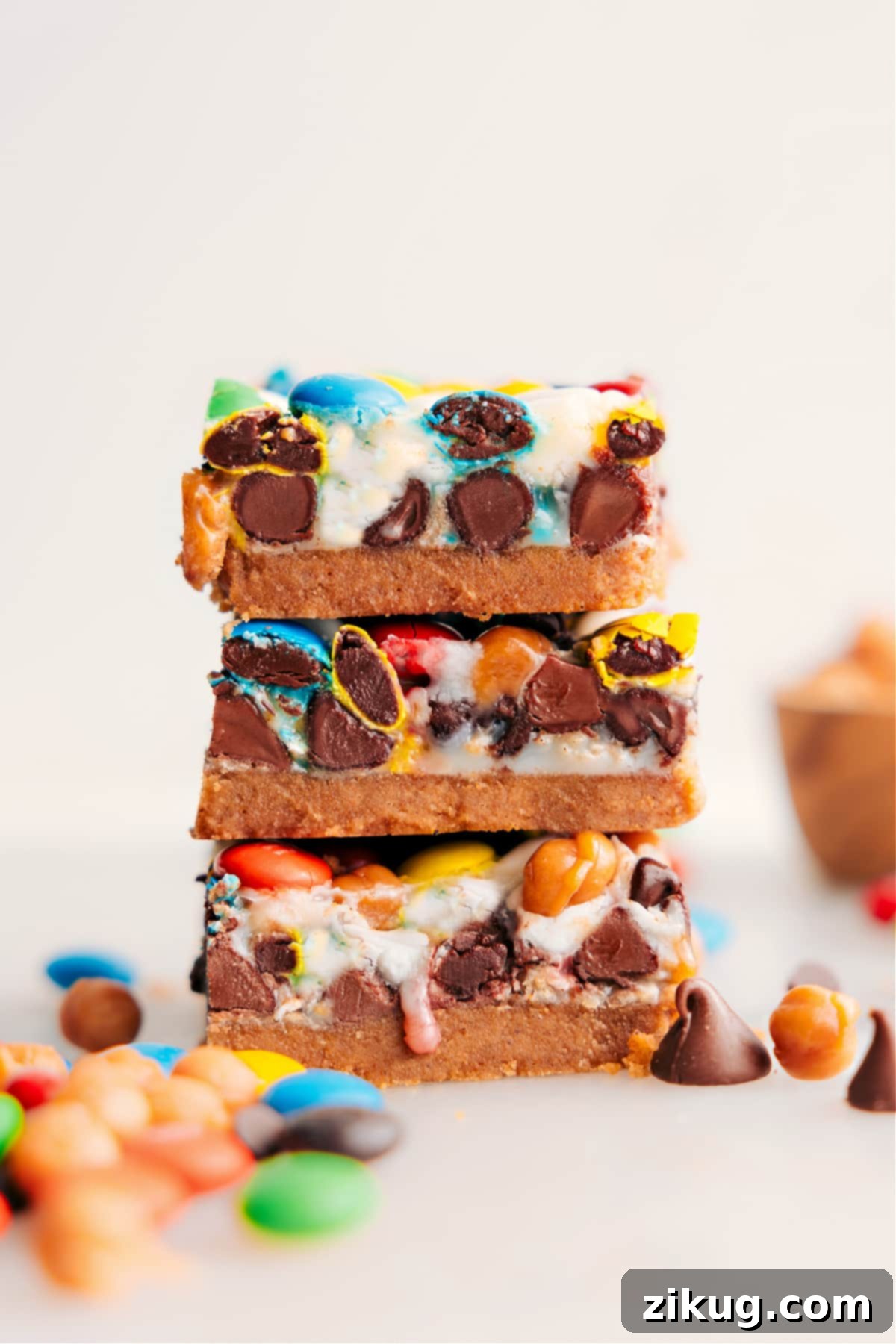 Stacked Magic Cookie Bars, showcasing their delicious layers and gooey texture.