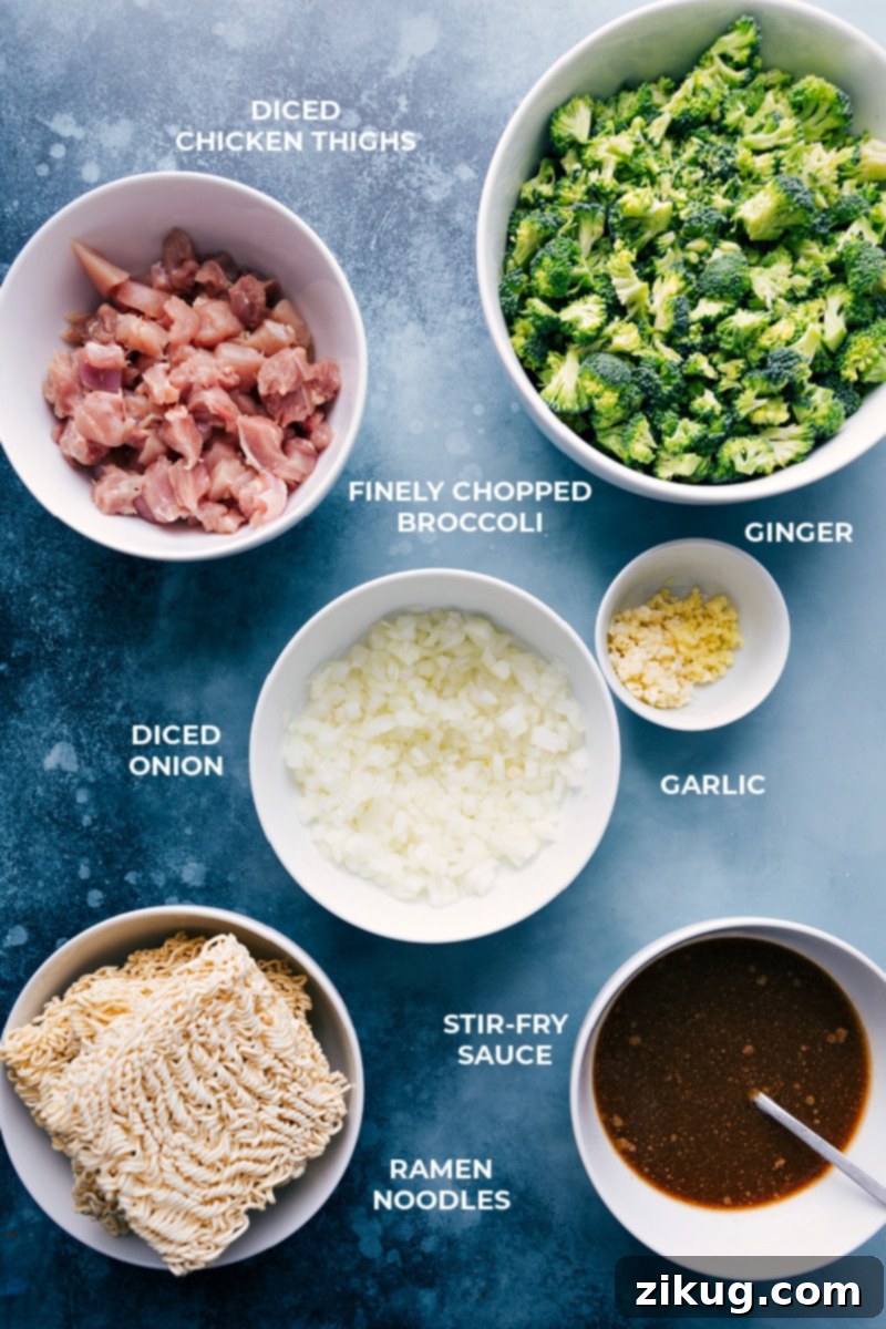 Fresh ingredients for making Chicken Ramen Noodles, including chicken, broccoli, onion, and spices