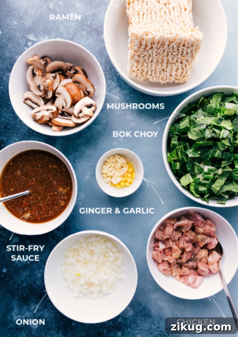 A collection of fresh ingredients laid out, ready for making General Tso Ramen, including chicken, noodles, vegetables, and sauce components.