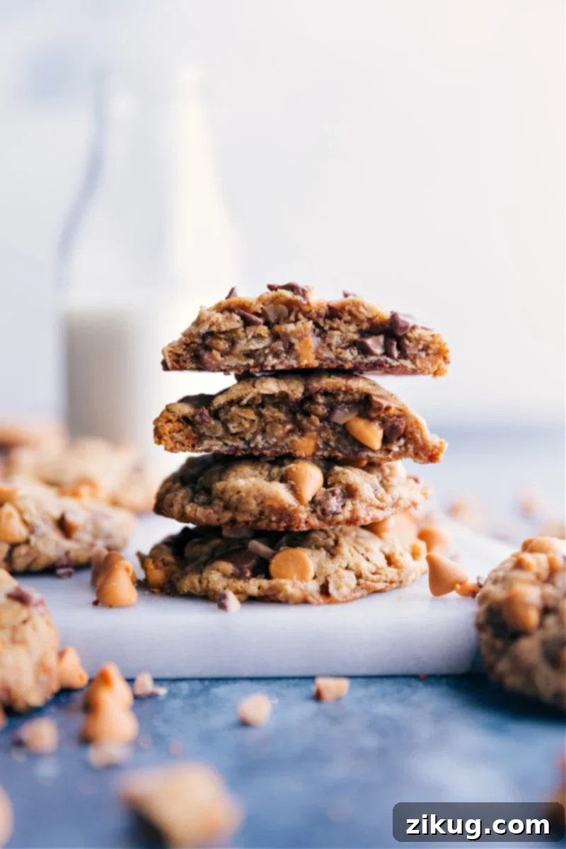 Irresistible Oatmeal Scotchies: thick, chewy, with deep caramel notes, cinnamon spice, butterscotch, and crushed toffee. A truly delicious, quick, and easy dessert recipe perfect for any sweet treat lover. A stack of perfectly baked Oatmeal Scotchies, showcasing their thick, chewy centers, crisp edges, and visible butterscotch and toffee bits. Ideal for a sweet dessert or snack.