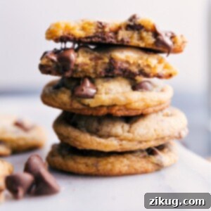 Close-up of a stack of Chocolate Chip Pudding Cookies, with some chocolate oozing out.