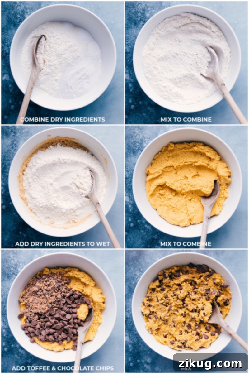 A bowl of cookie dough for Chocolate Chip Pudding Cookies, with chocolate chips and toffee bits folded in.