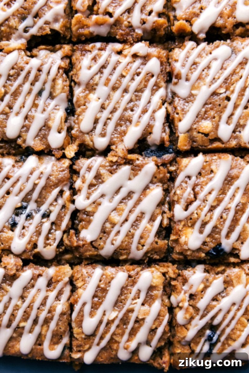 Overhead image of the blueberry oatmeal bars with glaze on top, arranged beautifully and ready to serve.