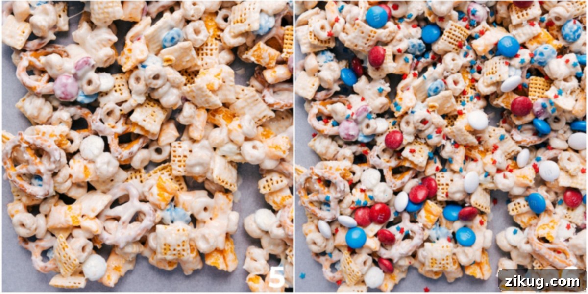 Spreading and Topping the Best 4th Of July Snack Mix Recipe The 4th of July Snack Mix spread evenly on a tray for hardening, with festive toppings being sprinkled over the fresh white chocolate coating.