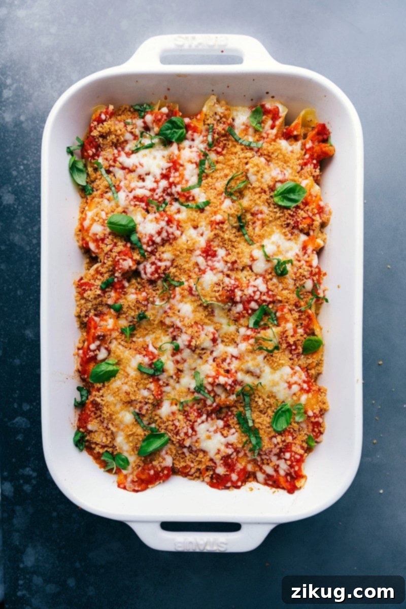 Chicken Parm Stuffed Shells Ready for Serving Warm and delicious Chicken Parm Stuffed Shells, ready to be served from a baking dish.